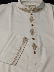 Close view of embroidered collar, front placket and cuff on off-white Punjabi