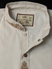 Close-up of standing collar and label on off-white Punjabi